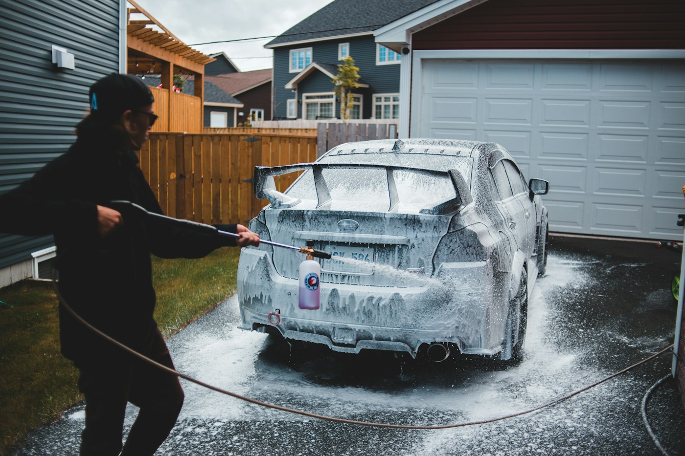 A car being washed on a residential driveway