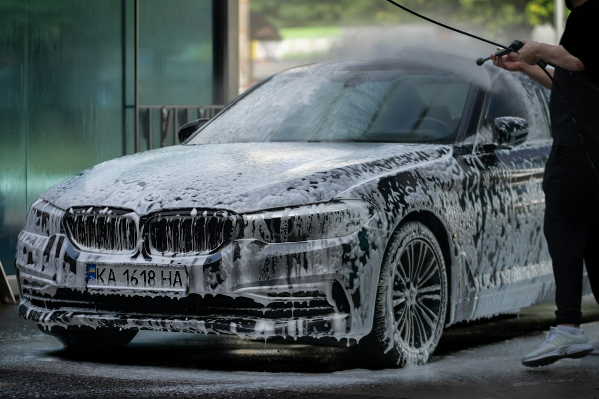 Foam and water washing a car